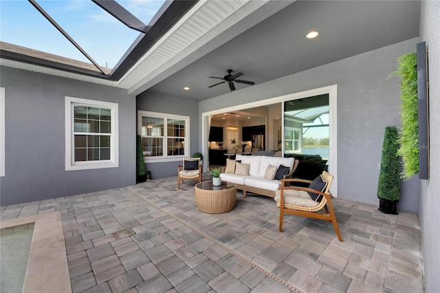 view of patio / terrace with an outdoor hangout area, ceiling fan, and a lanai