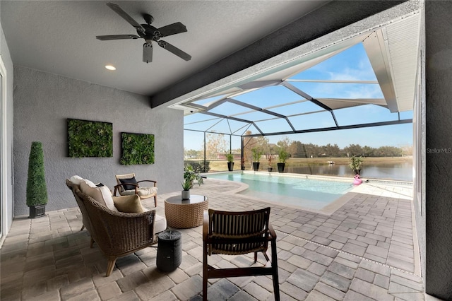 7506 Parkshore Dr, Apollo Beach, FL 33572 - outdoor pool with a patio, a ceiling fan, an outdoor hangout area, and a water view