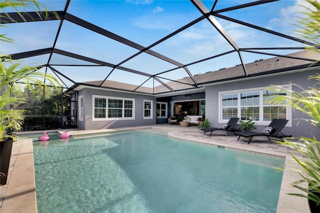 7506 Parkshore Dr, Apollo Beach, FL 33572 - swimming pool featuring a patio area, outdoor lounge area, a ceiling fan, and a lanai
