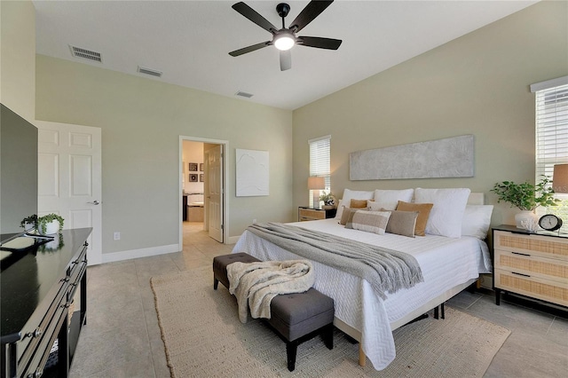 tiled bedroom featuring ensuite bath and ceiling fan