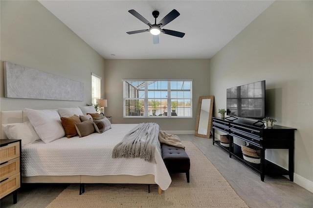 bedroom with multiple windows and ceiling fan