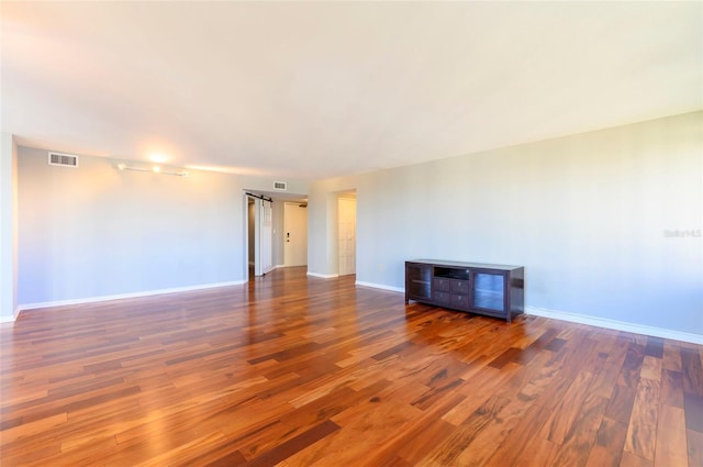 spare room with hardwood / wood-style floors