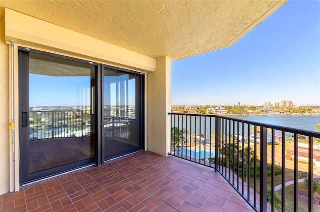 balcony featuring a water view