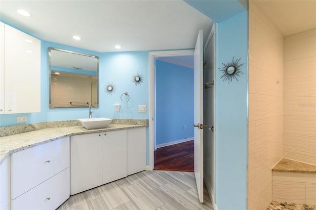 bathroom with vanity and hardwood / wood-style flooring