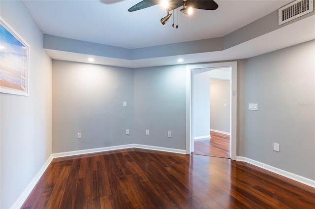 empty room featuring dark hardwood / wood-style floors and ceiling fan