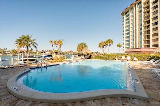 view of pool featuring a water view