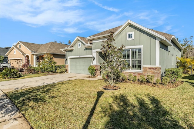 craftsman house with driveway, stone siding, a front lawn, and board and batten siding