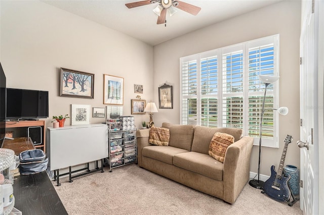 living room featuring ceiling fan and light carpet