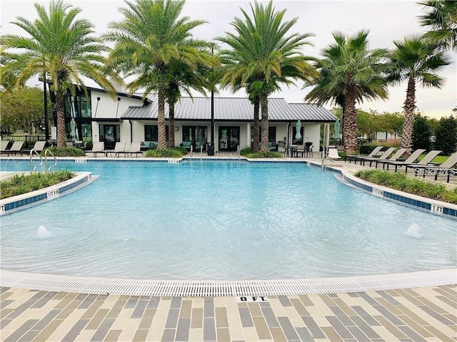 view of swimming pool featuring pool water feature