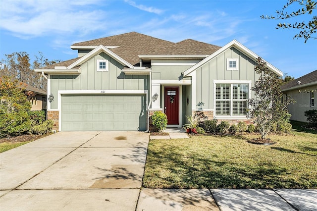 view of front of house with a garage and a front lawn