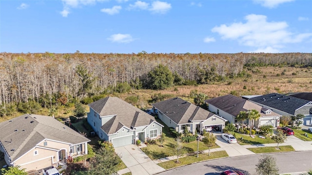 bird's eye view with a residential view and a view of trees