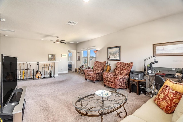 carpeted living room featuring a ceiling fan, visible vents, a textured ceiling, and baseboards