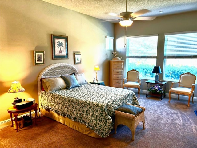 bedroom featuring a textured ceiling, carpet flooring, and baseboards