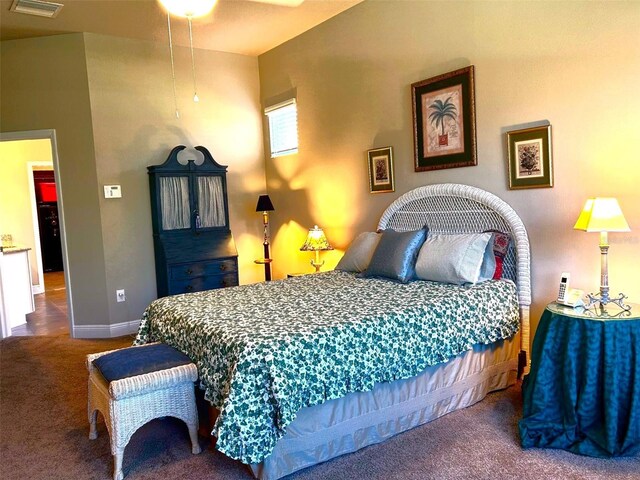 carpeted bedroom with baseboards and visible vents