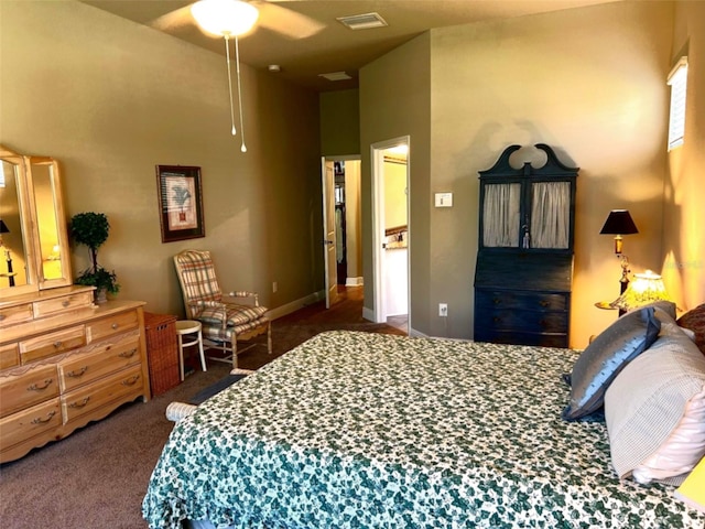 bedroom with visible vents, ceiling fan, and carpet flooring