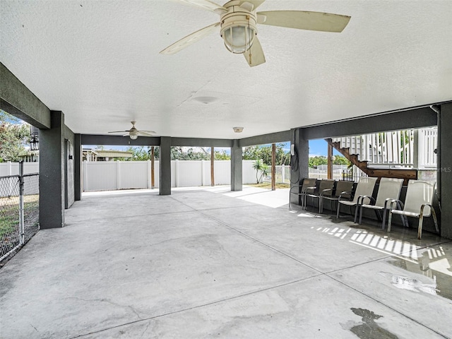 exterior space featuring a wealth of natural light and ceiling fan