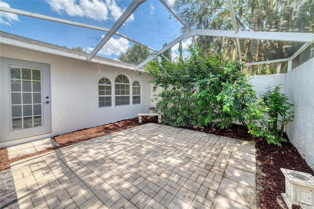 view of patio / terrace with glass enclosure