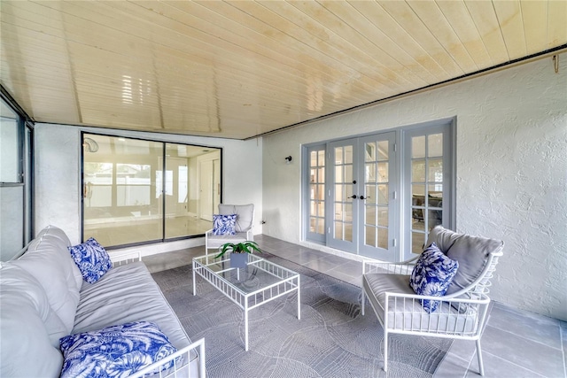 sunroom / solarium with wooden ceiling and french doors