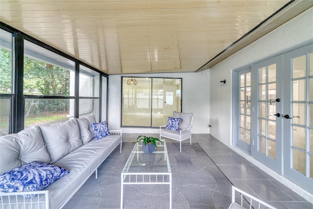 sunroom featuring french doors and wooden ceiling