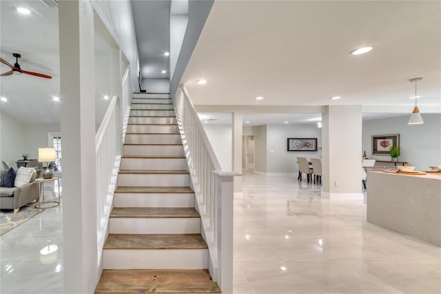 stairway with ceiling fan