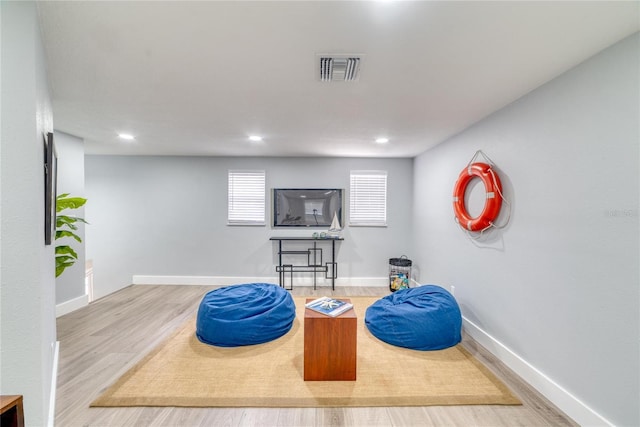 living area featuring hardwood / wood-style floors