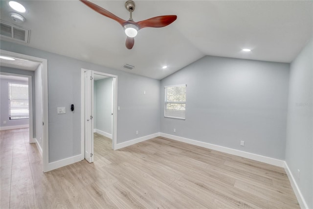 unfurnished room with light wood-type flooring, vaulted ceiling, and ceiling fan