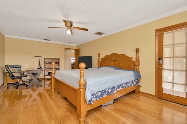 bedroom with a textured ceiling, light wood-type flooring, ceiling fan, and crown molding