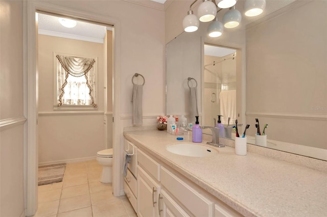 bathroom with ornamental molding, vanity, a shower, tile patterned flooring, and toilet