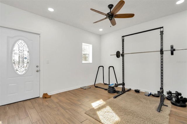 workout area with ceiling fan, baseboards, wood finished floors, and recessed lighting