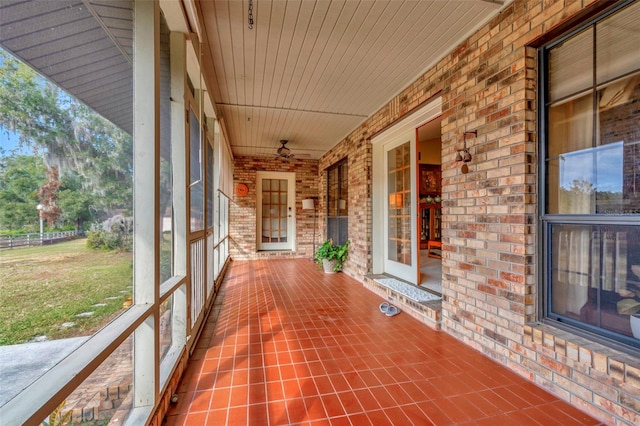 unfurnished sunroom featuring wooden ceiling