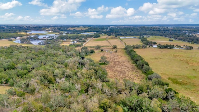 drone / aerial view with a rural view and a water view