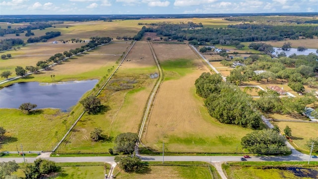 bird's eye view with a rural view and a water view