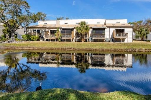 rear view of property featuring a water view