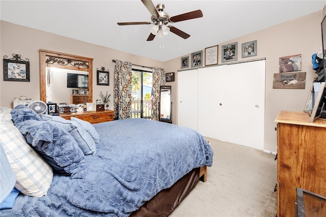 carpeted bedroom featuring a ceiling fan, access to exterior, and a closet