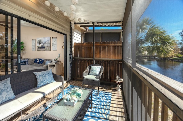 sunroom with a water view