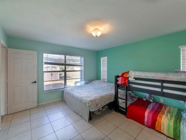 bedroom with light tile patterned floors