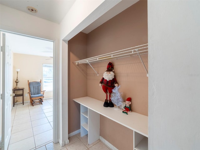 mudroom with light tile patterned flooring