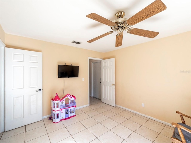 game room featuring light tile patterned floors and ceiling fan