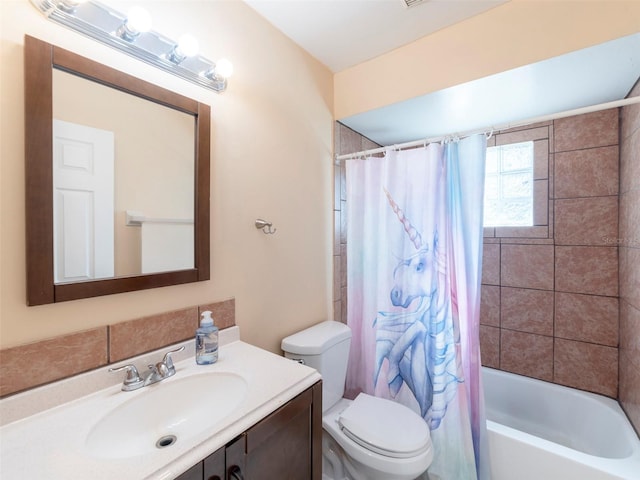 full bathroom with shower / bath combination with curtain, toilet, and vanity