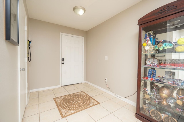 foyer featuring light tile patterned flooring