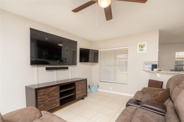 tiled living room featuring ceiling fan