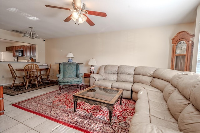 tiled living room featuring ceiling fan