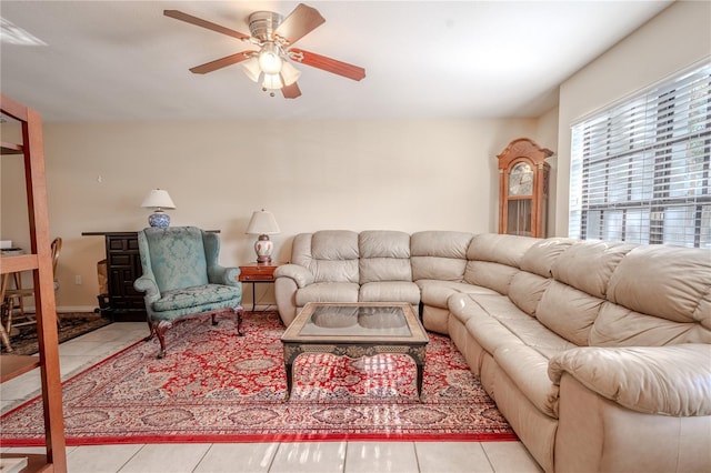 tiled living room with ceiling fan