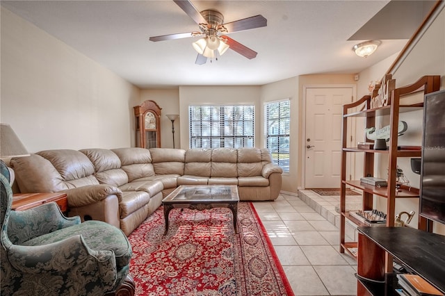 tiled living room with ceiling fan