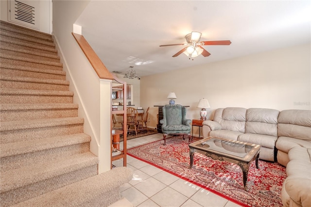 living room featuring light tile patterned floors and ceiling fan