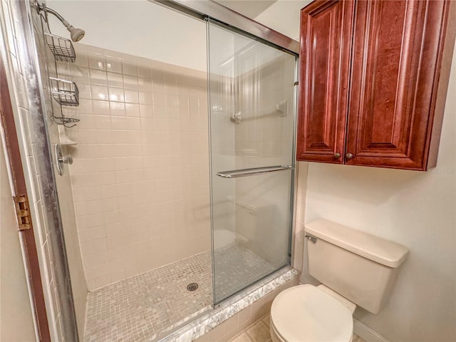 bathroom with toilet and walk in shower