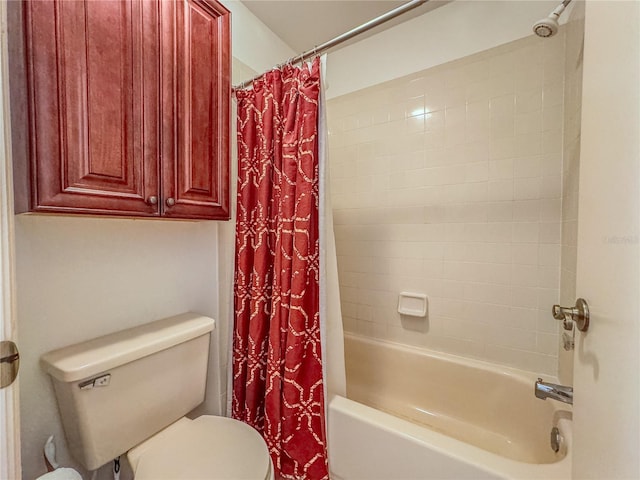 bathroom with shower / bath combo and toilet