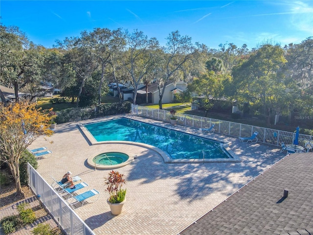 view of pool with a community hot tub and a patio