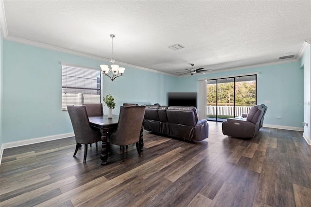 dining room with ceiling fan with notable chandelier, dark wood-type flooring, ornamental molding, and a textured ceiling