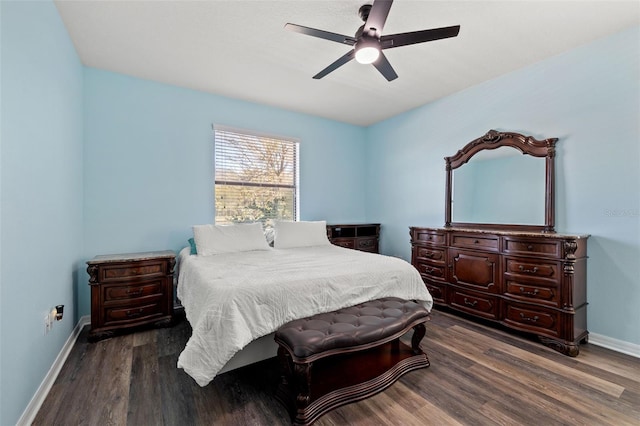 bedroom with dark hardwood / wood-style floors and ceiling fan